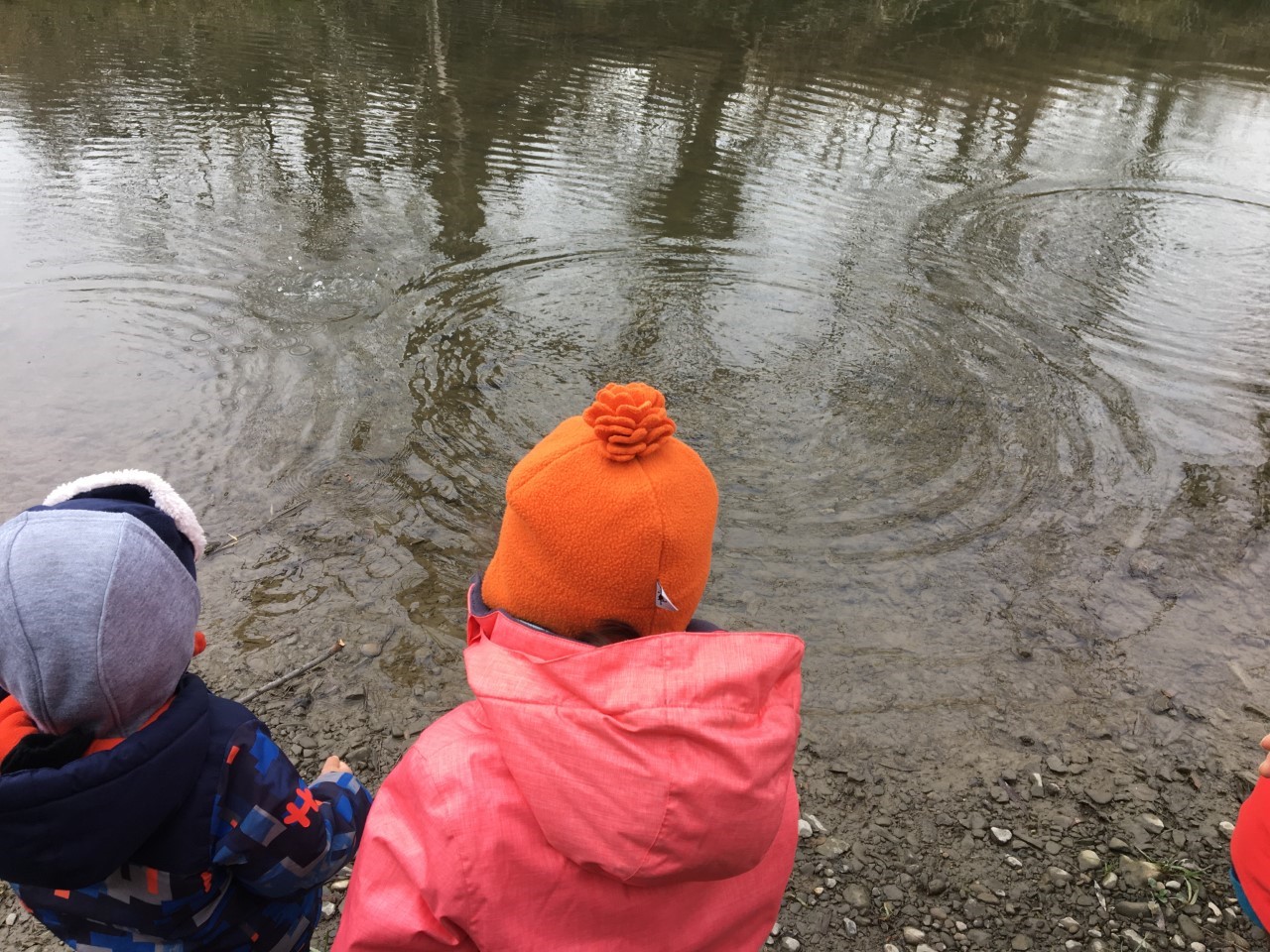 children looking at the river